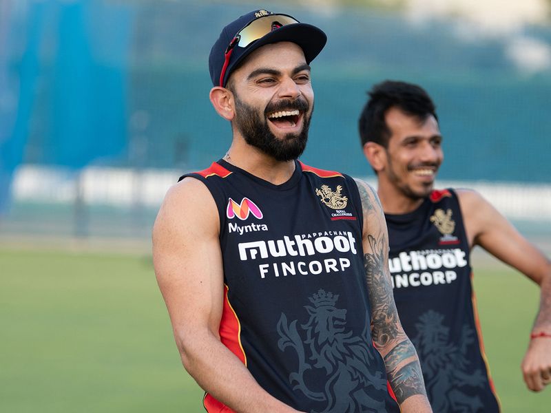 Royal Challengers Bangalore skipper Virat Kohli shares a laugh in training in Dubai