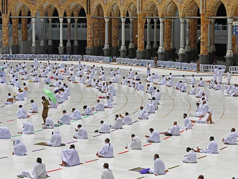 Worshippers pray inside the Grand Mosque in the Saudi holy city of Mecca, during the first Friday prayers of Ramadan, on April 16, 2021. 