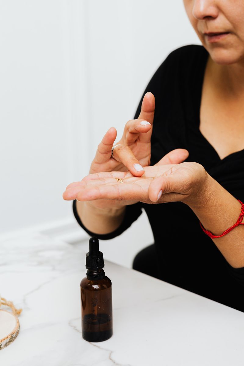 Mixing hair oil on palm 