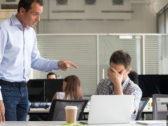 A boss yelling at his employee