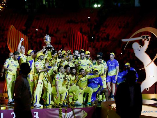 Chennai Super Kings' players pose with the IPL trophy