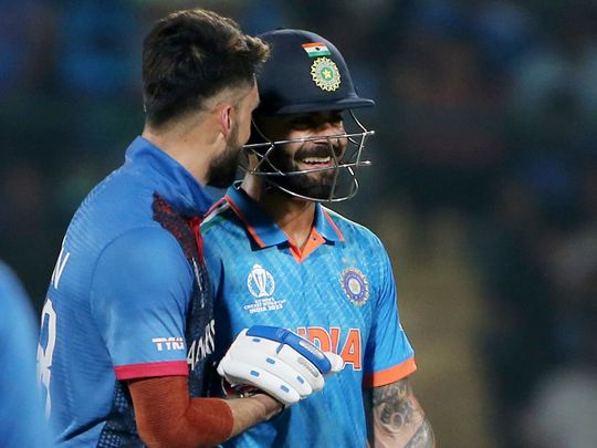 India's Virat Kohli and Afghanistan's Naveen-ul-Haq share a candid moment