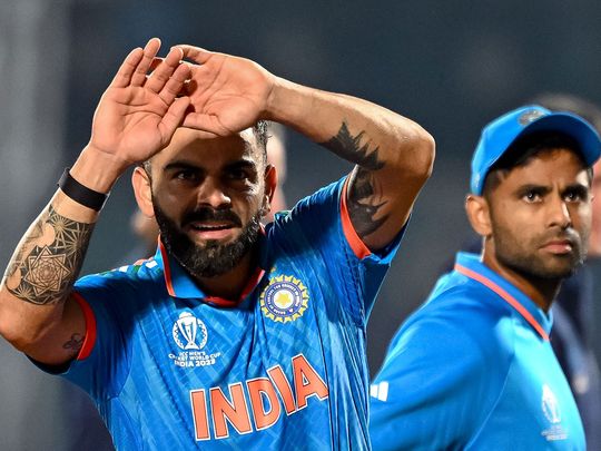 India's Virat Kohli (L) and Suryakumar Yadav look on at the end of the 2023 ICC Men's Cricket World Cup one-day international (ODI) match between India and New Zealand at the Himachal Pradesh Cricket Association Stadium in Dharamsala on October 22, 2023.