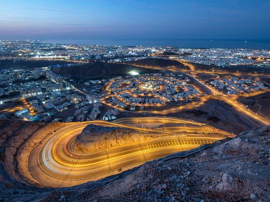 An aerial view of Muscat city, at night. 