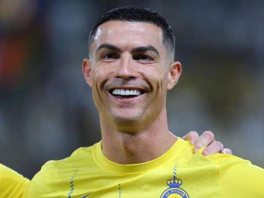 Nassr's Portuguese forward #07 Cristiano Ronaldo smiles during the AFC Champions League Group E football match between Saudi's al-Nassr and Iran’s Persepolis at the Al-Awwal Stadium in Riyadh on November 27, 2023. (Photo by Fayez NURELDINE / AFP)