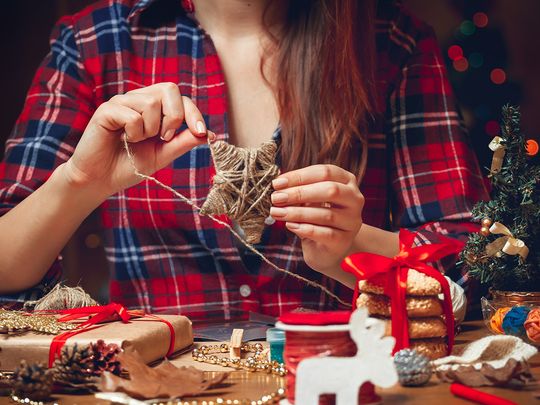 Person making Christmas figures