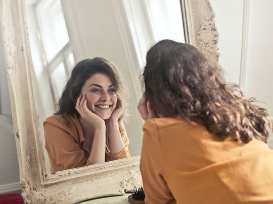 Person staring at the mirror