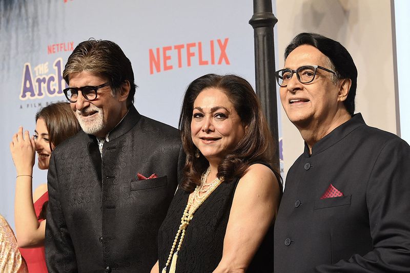 Bollywood actor Amitabh Bachchan (L) with his brother Ajitabh Bachchan (R) and actress Tina Ambani (C) attend the premiere of Netflix's Indian Hindi-Language teen musical comedy film ‘The Archies’ in Mumbai on December 5, 2023. (Photo by SUJIT JAISWAL / AFP)