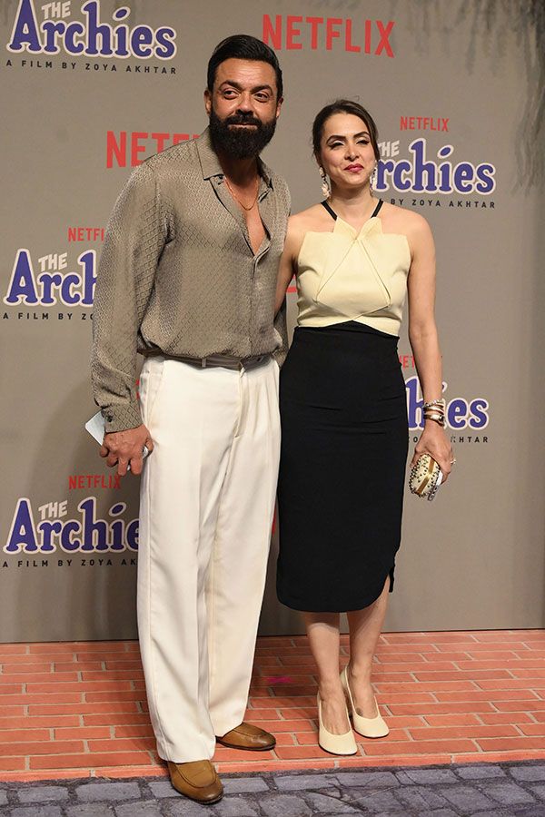 Bollywood actor Bobby Deol (L) with his wife attend the premiere of Netflix's Indian Hindi-Language teen musical comedy film ‘The Archies’ in Mumbai on December 5, 2023. (Photo by SUJIT JAISWAL / AFP)