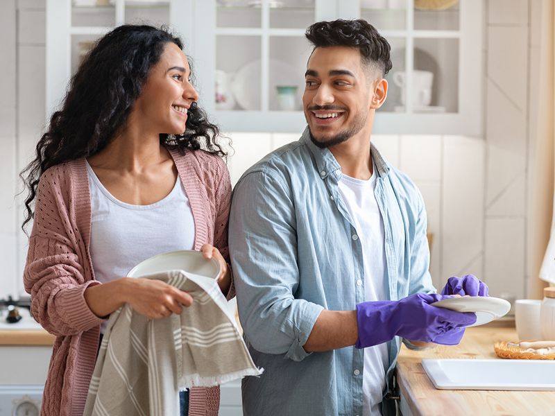 Couple washing dishes