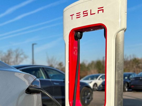 FILE PHOTO: Tesla Supercharger station at a Tesla store in Ann Arbor, Michigan, U.S., December 7, 2023. REUTERS/Paul Lienert/File Photo